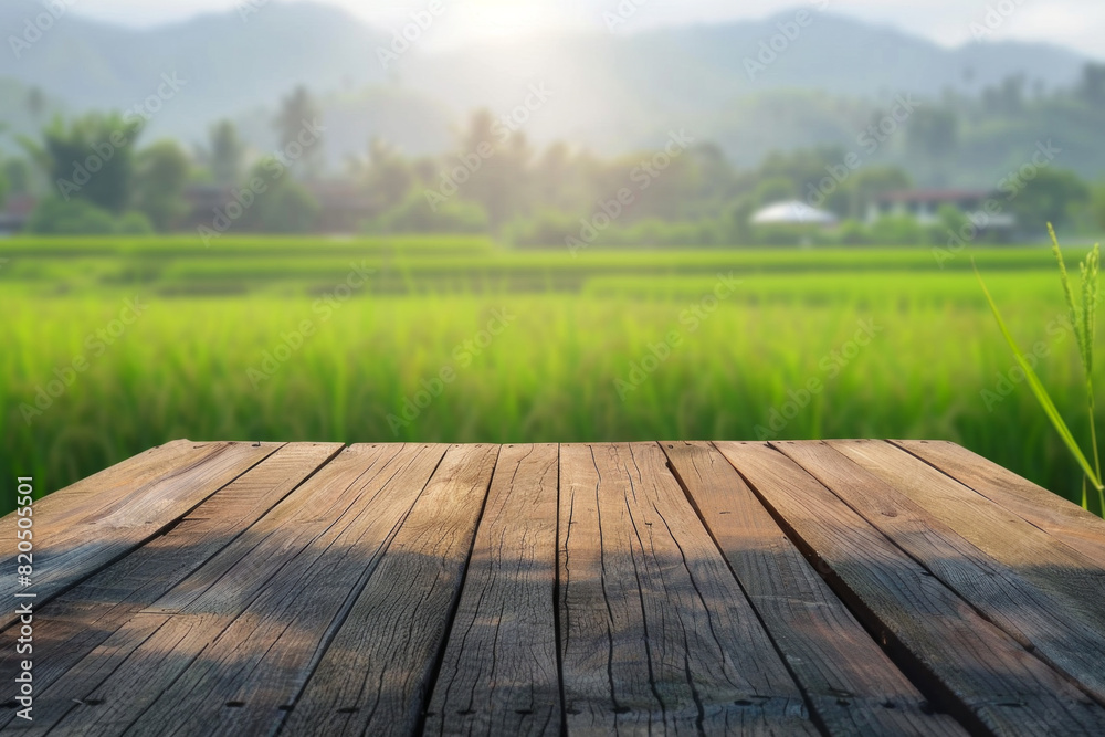 A wooden desk top with blurred background of paddy field. Good for background A wooden desk top with blurred background of paddy field. Good for background