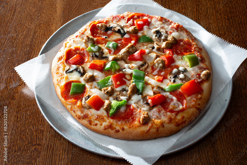 A view of a deluxe personal pizza. A view of a deluxe personal pizza.