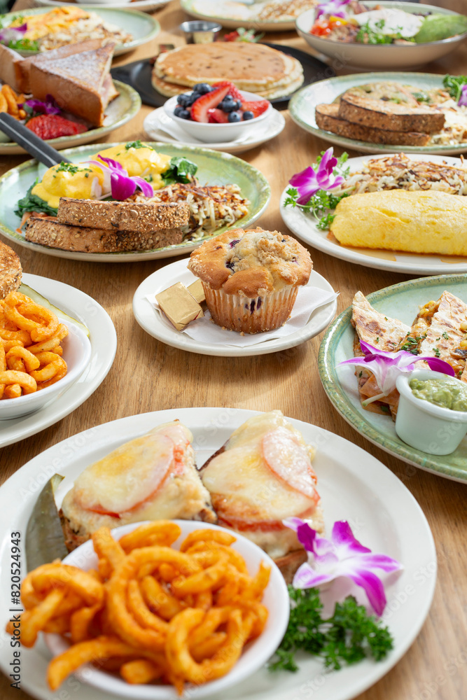 A view of a variety of breakfast and brunch food items on a table. A view of a variety of breakfast and brunch food items on a table.