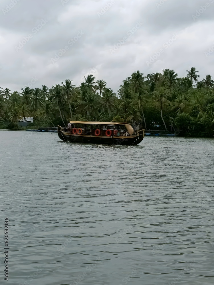 Kettuvallam is a houseboat widely used in the Indian state of Kerala. These have thatched roof covers over wooden hulls. The traditional kettuvallam is mainly used for promoting Kerala tourism.
Kettuvallam is a houseboat widely used in the Indian state of Kerala. These have thatched roof covers over wooden hulls. The traditional kettuvallam is mainly used for promoting Kerala tourism.