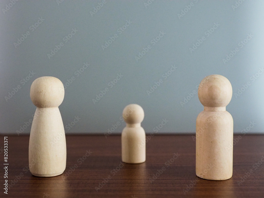 Parents and children made of wood standing apart family closeness Parents and children made of wood standing apart family closeness