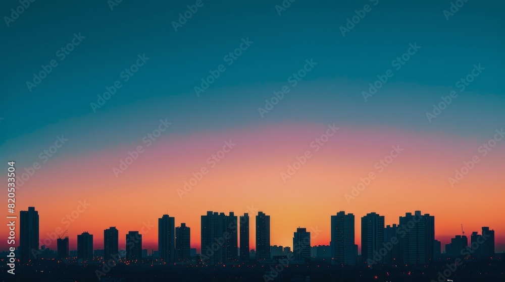 City Skyline Silhouetted Against Colorful Sunset