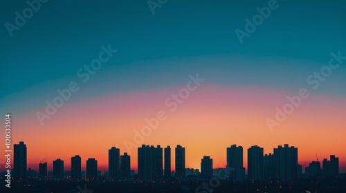 City Skyline Silhouetted Against Colorful Sunset