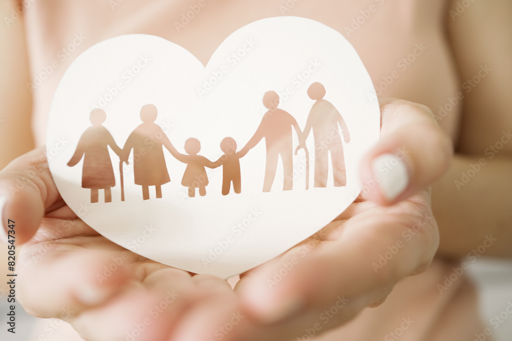 Hands holding multi generational family paper, family wellness, health insurance concept
Hands holding multi generational family paper, family wellness, health insurance concept