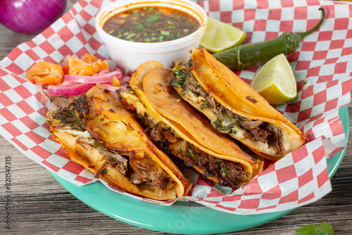 A closeup view of a plate of quesa tacos.