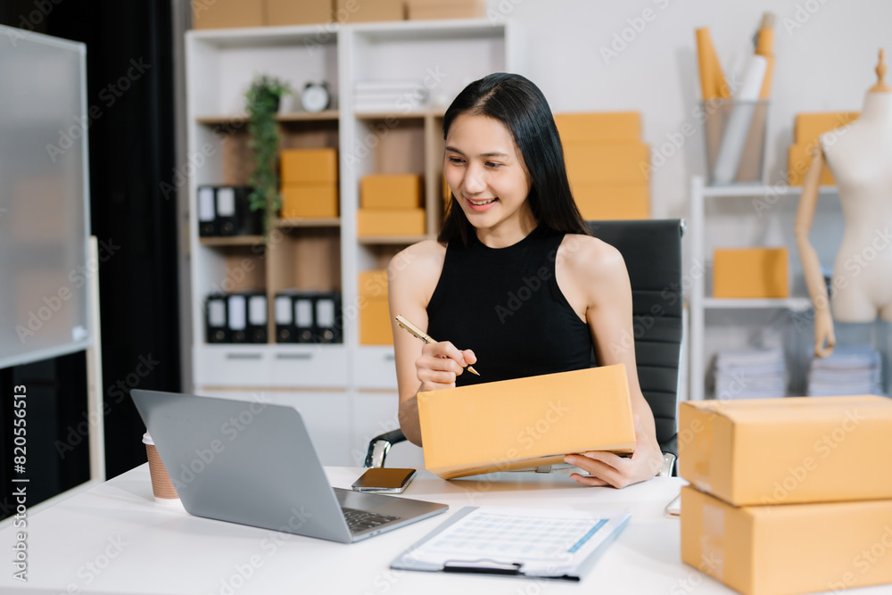 Small business entrepreneur SME freelance woman working at home office, BOX,tablet and laptop online, marketing