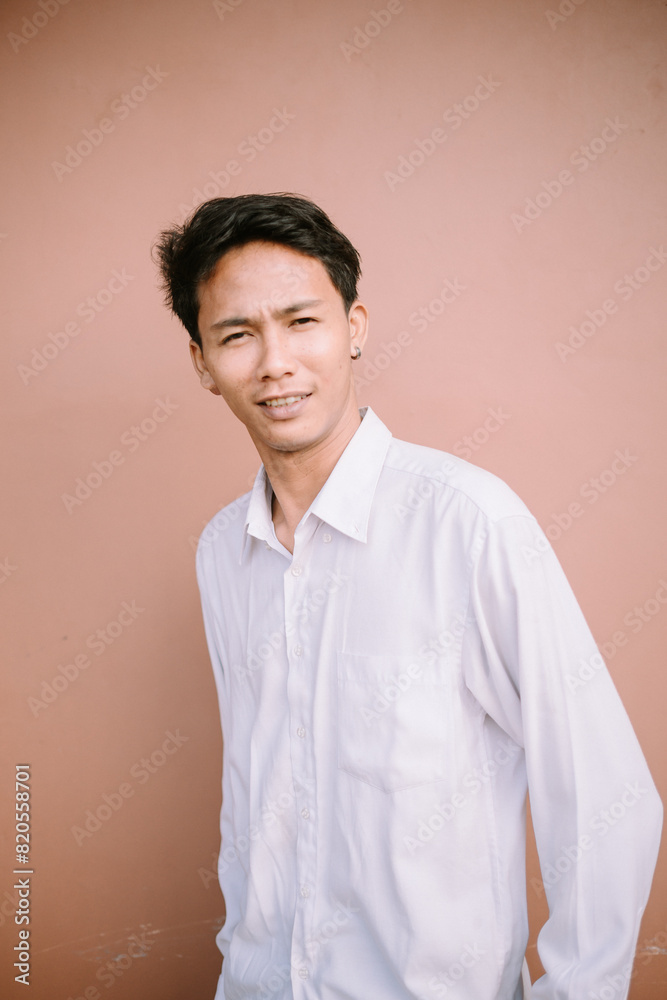 A man with a subtle smile, gazing forward, exuding a calm and approachable demeanor. A man with a subtle smile, gazing forward, exuding a calm and approachable demeanor.