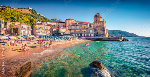 Hot summer day on Santa Maria di Castellabate puclic beach, Italy, Europe. Wonderful outdoor scene of italian resort. Vacation concept background.