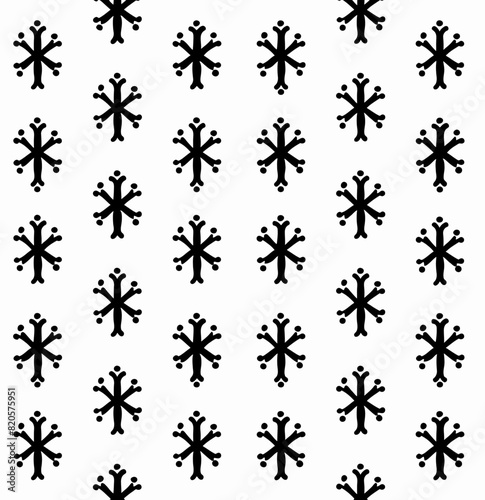 a black and white pattern of snow flakes