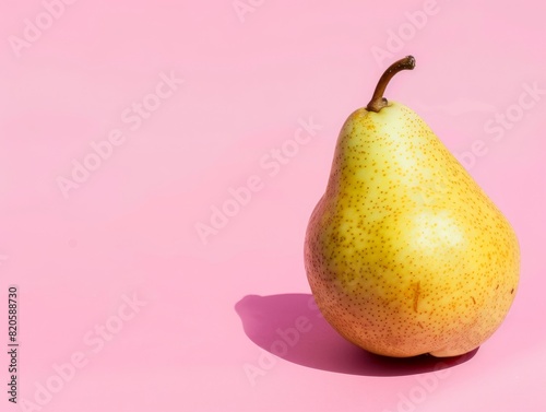 Savoring the Sweetness: A Closeup of a Yellow Pear on a Pink Background