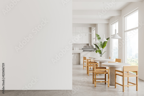 Modern kitchen and dining area with wooden chairs and white tables, minimalistic style, light background, interior design mockup. 3D Rendering.