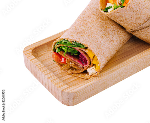 Fresh chicken wrap sandwich on wooden board
