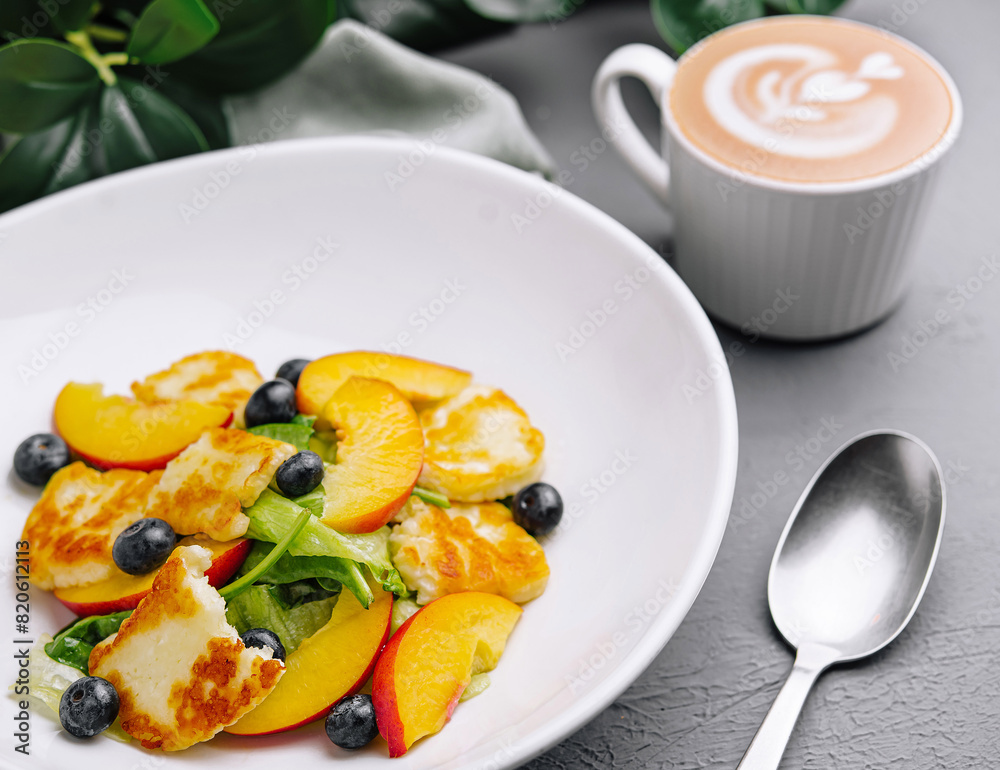 Fresh fruit salad with halloumi cheese and coffee Fresh fruit salad with halloumi cheese and coffee