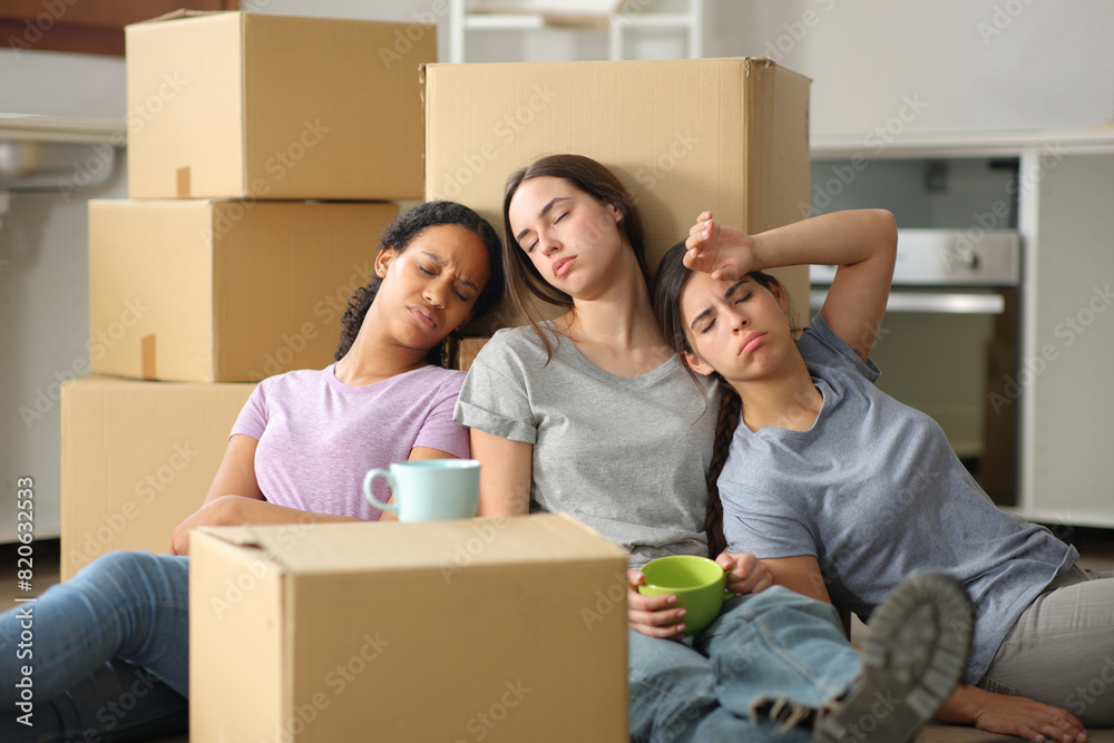 Three tired multi ethnic women moving house Three tired multi ethnic women moving house