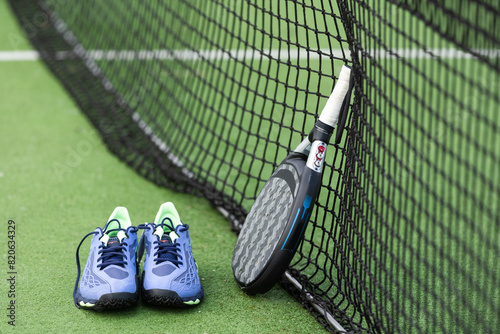 Padel tennis racket sport court and balls. Download a high quality photo with paddle for the design of a sports app or soical media advertisement