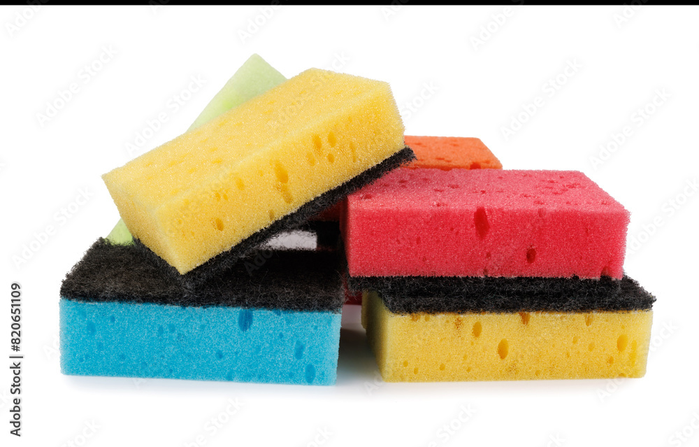 Several multi-colored dishwashing sponges isolated on a white background. Household sponges scattered on white. Several multi-colored dishwashing sponges isolated on a white background. Household sponges scattered on white.
