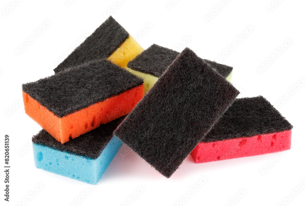 Multi-colored dishwashing sponges isolated on a white background. Household sponges scattered on white. Multi-colored dishwashing sponges isolated on a white background. Household sponges scattered on white.