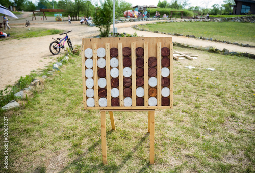 Wooden game Connect Four (known as Connect 4, Four Up, Plot Four), giant figures without people