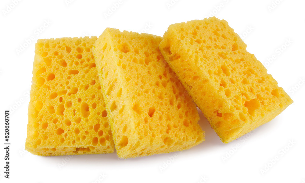 Fototapeta premium Several yellow sponges for washing dishes isolated on a white background. Household cleaning sponge.
