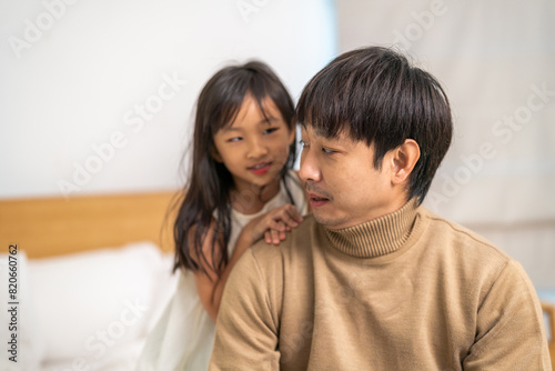 Portrait of enjoy happy love asian family mature father and little girl daughter smiling play laughing and having fun together.happy family and father's Day in moments good time at home © Art_Photo