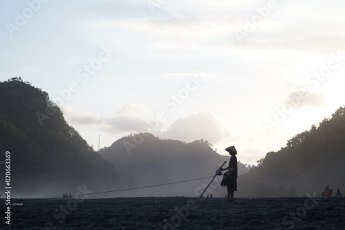 a fisherman is fishing in the sea