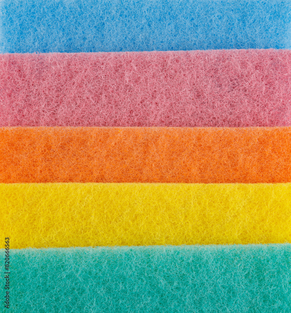 Multi-colored cleaning sponge. Background made from multi-colored cleaning cloth. Multi-colored cleaning sponge. Background made from multi-colored cleaning cloth.