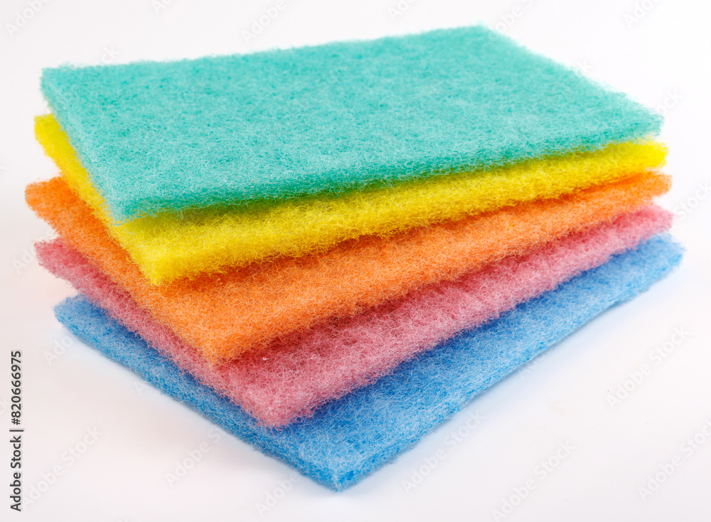 Multi-colored cleaning sponge. Background made from multi-colored cleaning cloth. Multi-colored cleaning sponge. Background made from multi-colored cleaning cloth.