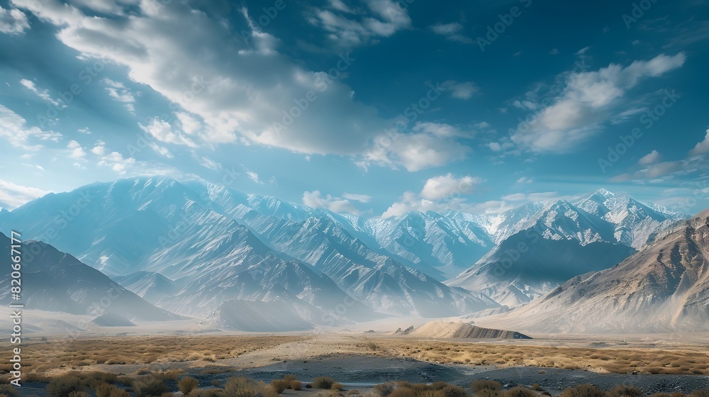 Fototapeta premium Majestic Mountain Range Under Vast Sky Conveying Solitude and Grandeur