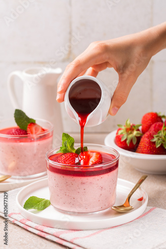 Cooking Strawberry panna cotta. Made with roasted strawberries, delicious, creamy dessert. Flowing sauce.