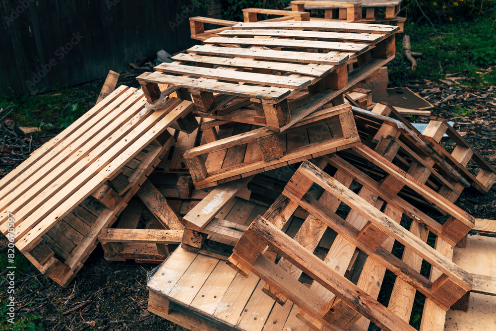 Fototapeta premium Pile of old used wooden Euro Pallets