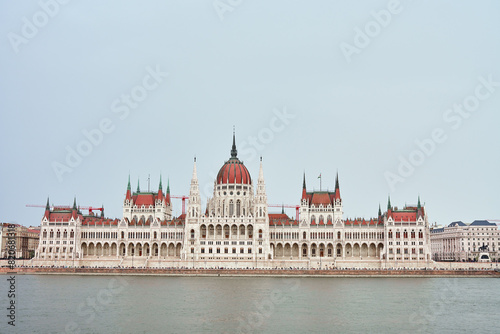 Hungarian Parliament with river Danube, front view. Famous landmark in Budapest. Beautiful architecture with historical building