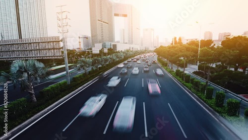 Time lapse of moving traffic in city evening