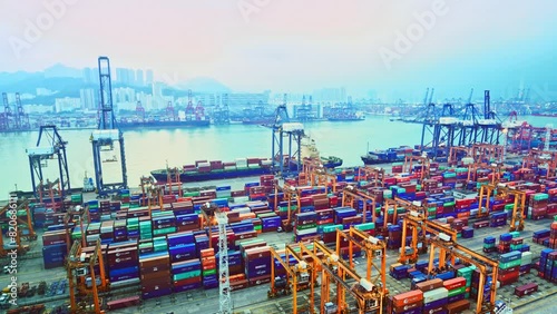 Time lapse of  cargo freight containers and ship in the port at dawn photo