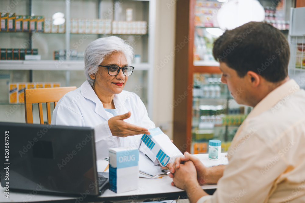 Pharmacist giving advice And advice for patients who come to buy Medicine, Drugs, Vitamins products, according to prescriptions in modern pharmacies. Pharmacist giving advice And advice for patients who come to buy Medicine, Drugs, Vitamins products, according to prescriptions in modern pharmacies.
