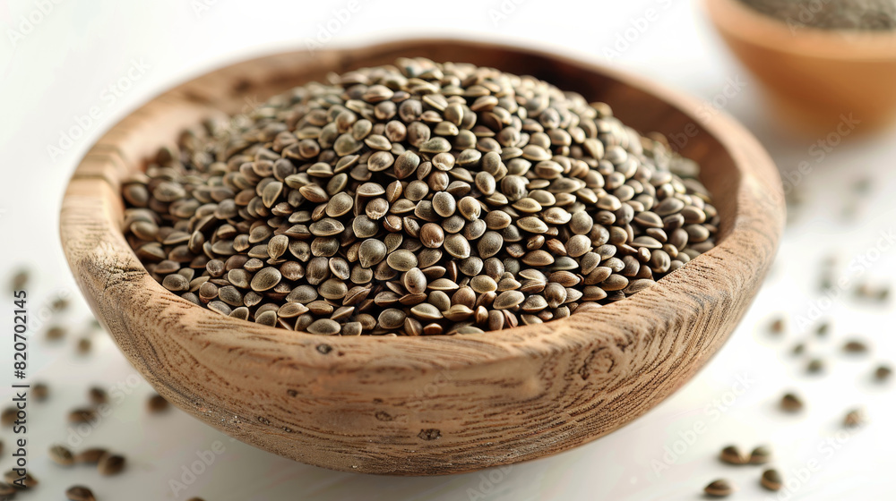 Hemp seeds in a bowl on a white background. Generative AI. Hemp seeds in a bowl on a white background. Generative AI.