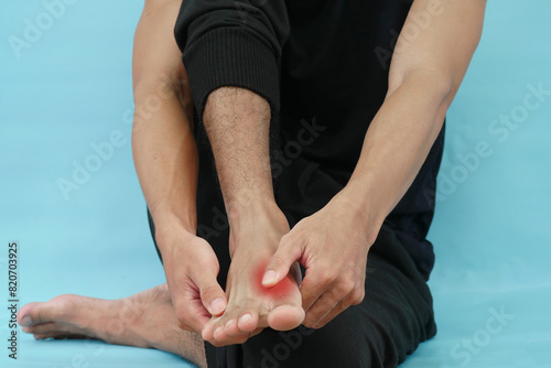 Human hand holding a sore leg, joint pain, gout, leg pain, soreness and injury. photo