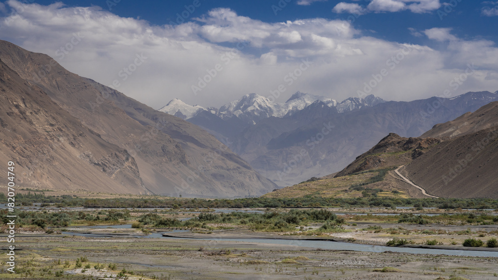 Scenic landscape view on Hindu Kush mountain range near Ishkashim, start of Wakhan Corridor, Gorno-Badakhshan, Tajikistan Pamir