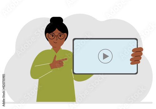 Woman holding tablet computer with video player. Marketing concept in flat style.