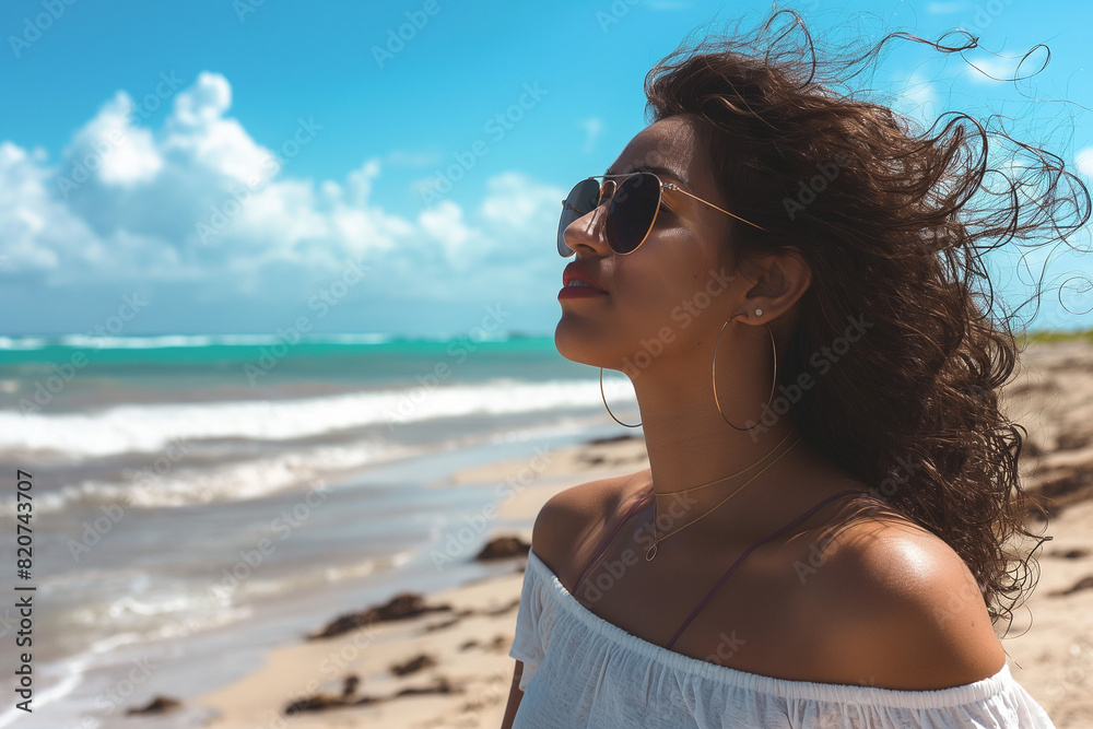 A woman with long hair is standing on a beach, wearing sunglasses A woman with long hair is standing on a beach, wearing sunglasses