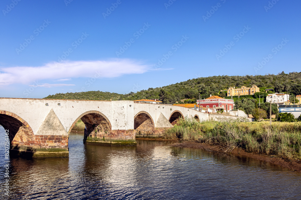 Fototapeta premium Ancient Roman bridge over Arade River in Silves, Algarve Portugal