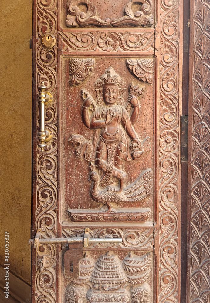 Beautiful details of ancient carved wooden door. Kathmandu Beautiful details of ancient carved wooden door. Kathmandu