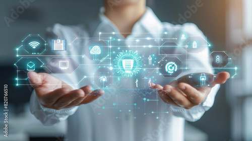 A person is holding virtual icons of technology and cybersecurity in their hands, symbolizing advanced digital security and network protection systems.