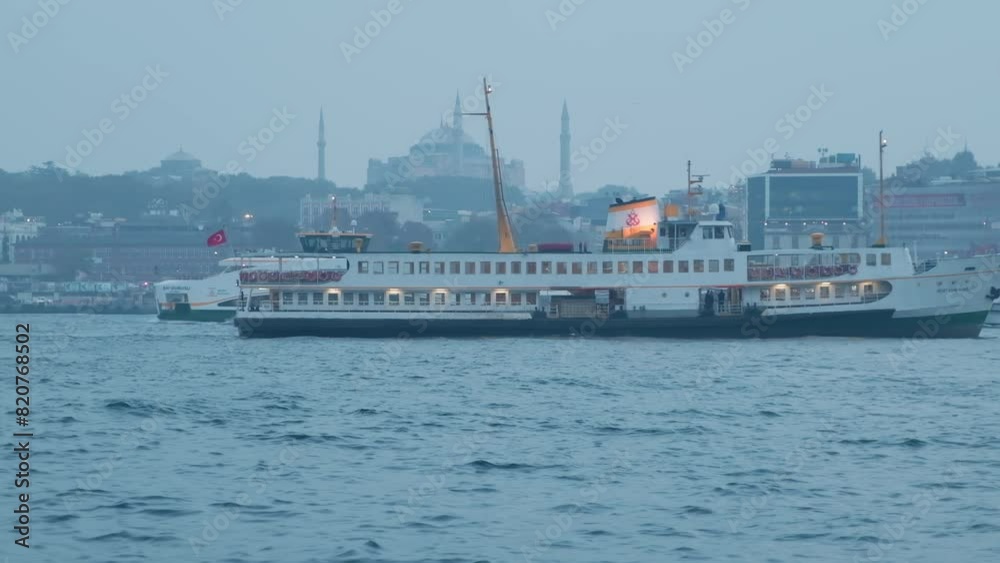 several ferry boats passing by the river in the background of the city density and the blue river water in the afternoon. several ferry boats passing by the river in the background of the city density and the blue river water in the afternoon.