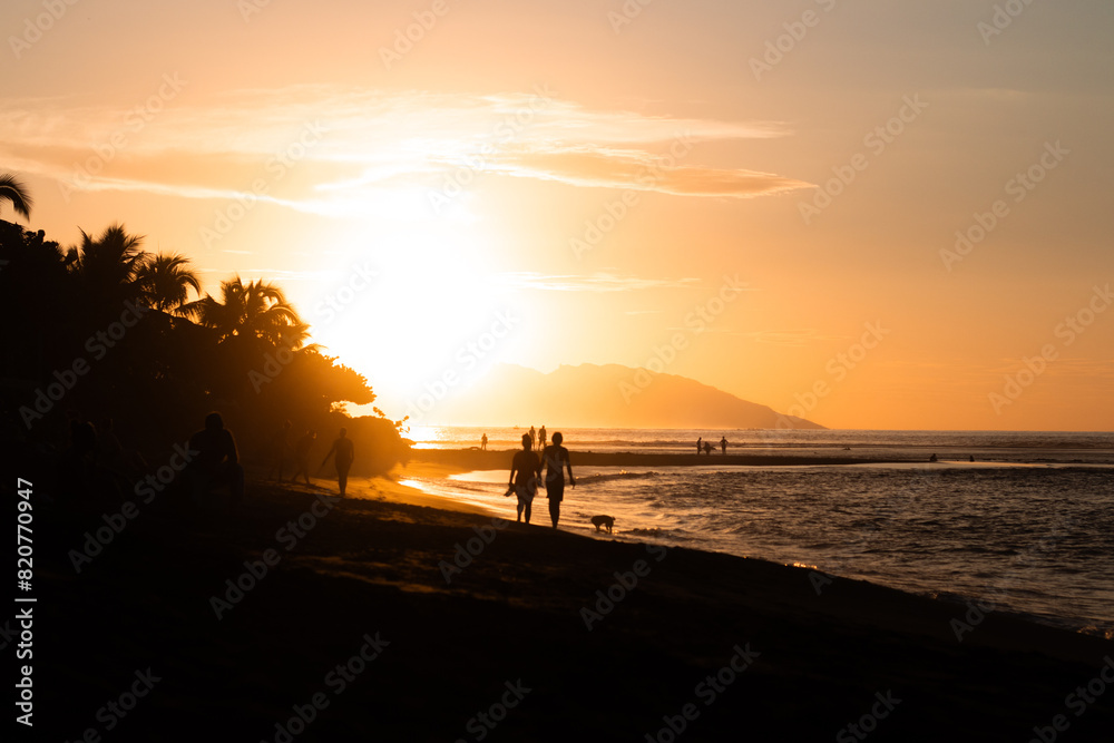 Sunset in Tahiti, peoples in the shadow Sunset in Tahiti, peoples in the shadow