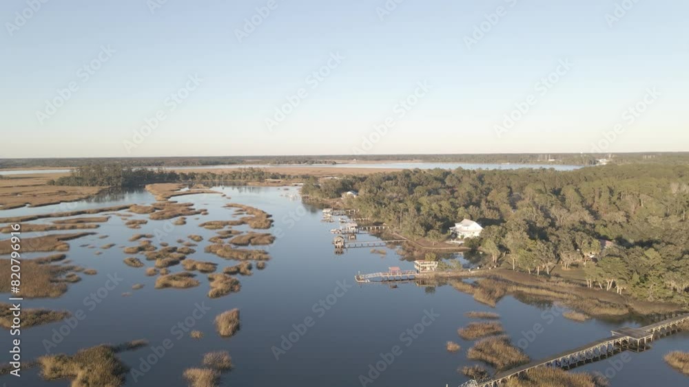 Beautiful view of a lake surrounded by flat fields Beautiful view of a lake surrounded by flat fields