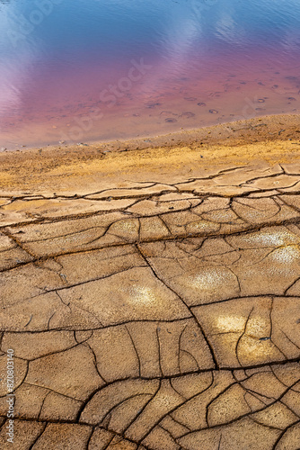 Dried mud patterns and rich red waters at riotinto photo