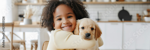 smiling happy child girl hugging puppy dog, pet friend, young owner at home , childhood joy, pet love and family life photo