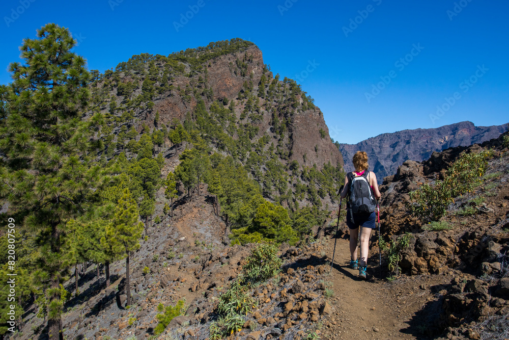 Young woman summit to Bejenado Peak in Caldera de Taburiente, La Palma, Spain Young woman summit to Bejenado Peak in Caldera de Taburiente, La Palma, Spain