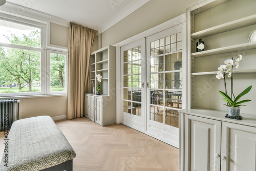 Elegant interior design of a cozy room with garden view photo