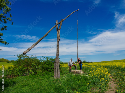 An old well in the middle of the field